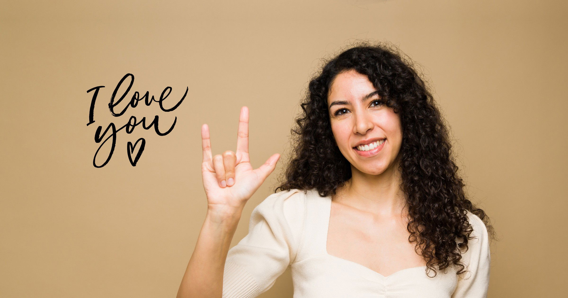 A woman saying I Love You in Sign Language