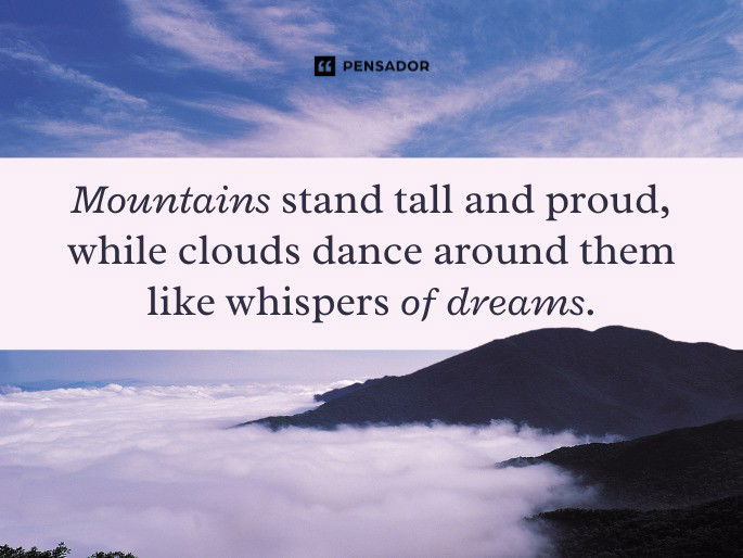 Mountains stand tall and proud, while clouds dance around them like whispers of dreams.